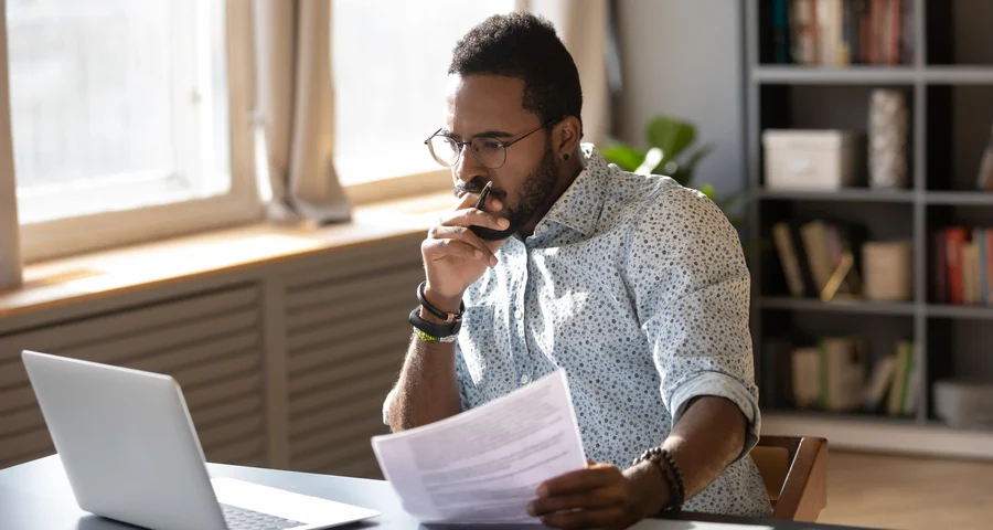 Man working behind a laptop