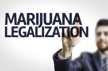 Person pointing at the words "Marijuana Legalization"