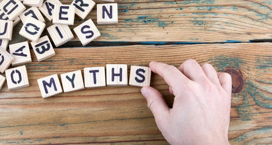 Scrabble game letters spelling out the word "myths"