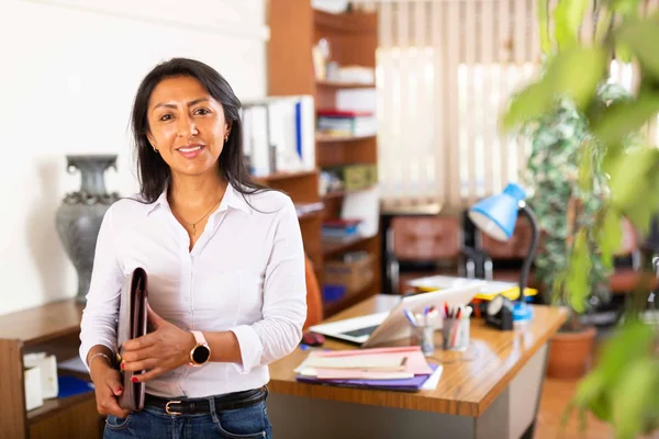 A happy female employer after a successful background check