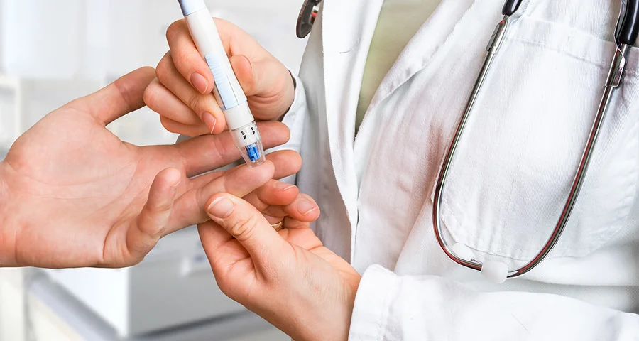 patient doctor measuring blood sugar