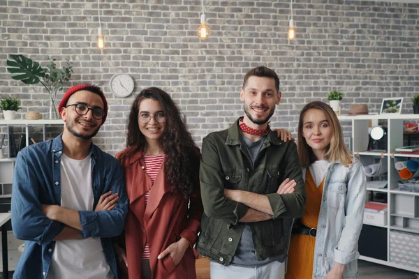 Four young people in a creative office enviroment