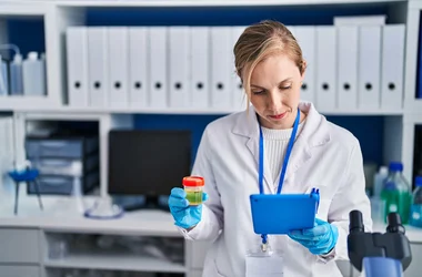 woman analyzing drug test urine sample