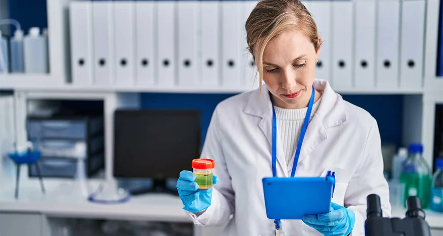woman analyzing drug test urine sample