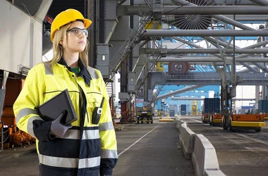employee wearing safety glasses and hat