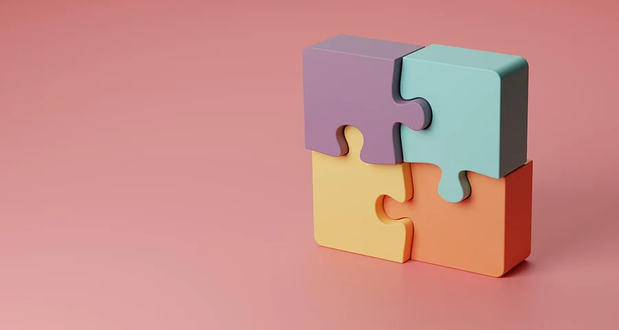 four puzzle pieces making a block
