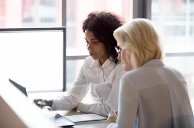 Two women in an office enviroment