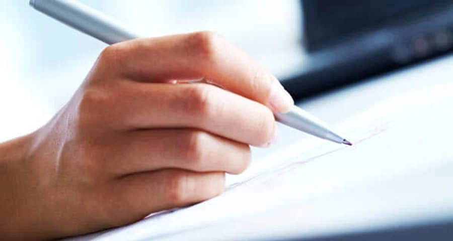 close up image of handwriting with red ink