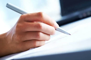 close up image of handwriting with red ink