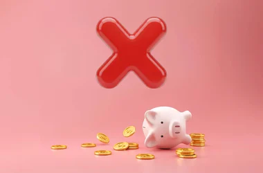 Downloaded Piggy bank and golden coins on pink background with lost money concept
