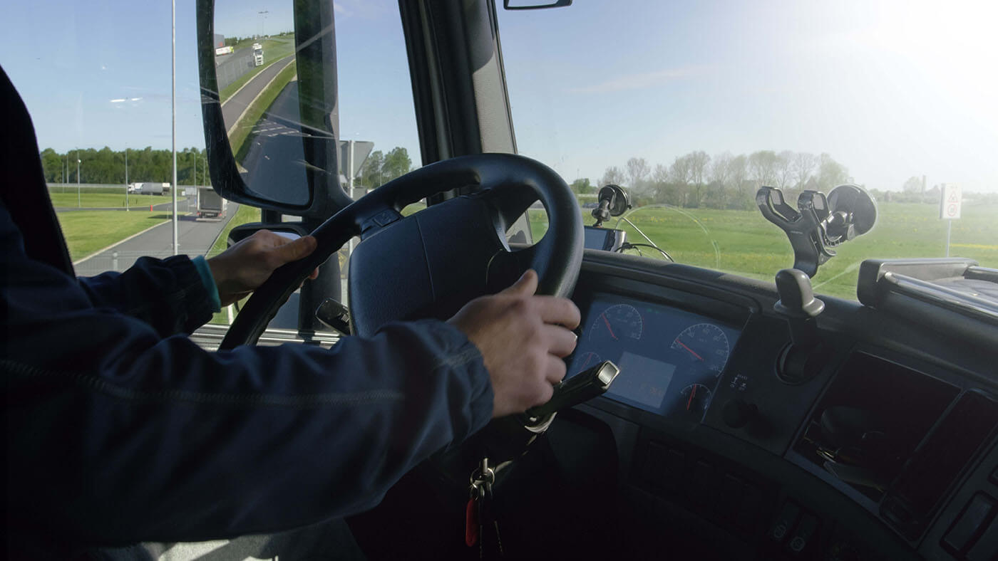 Truck Driver with hands on the wheel