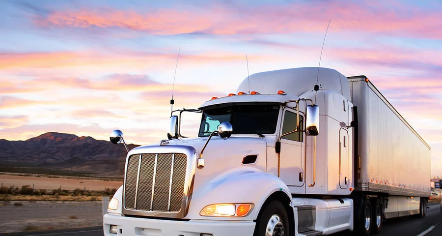truck driving at sunrise