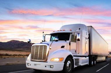 truck driving at sunrise