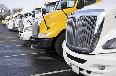 Transport trucks front ends parked in a row