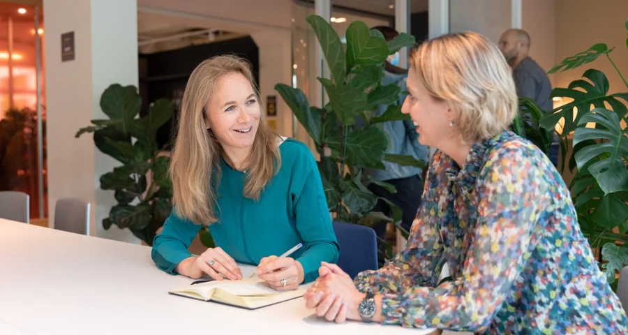 Two women talking about In-employment Screening