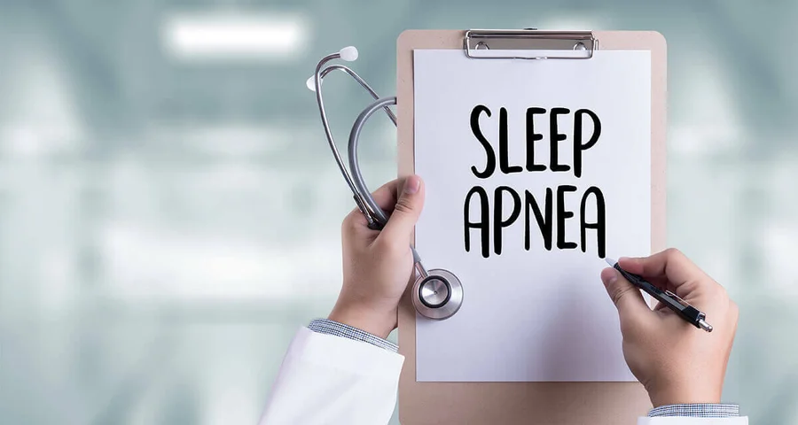 doctor diagnosing sleep apnea