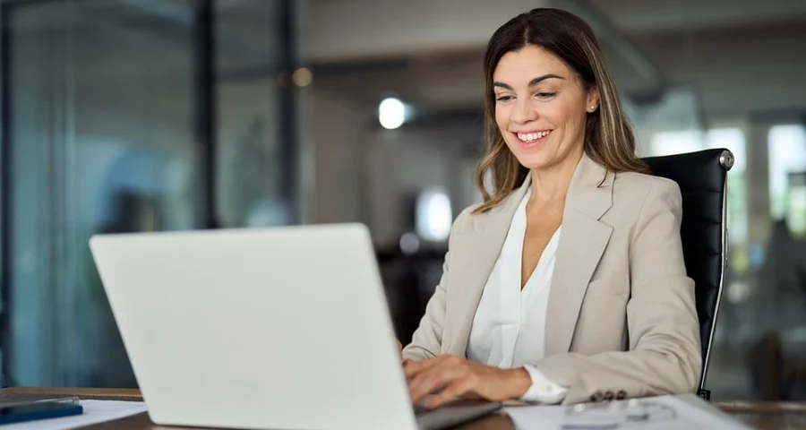 Woman sitting at a computer in an office environment