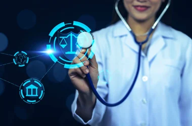 Healthcare worker holding a stethoscope up to a legal icon
